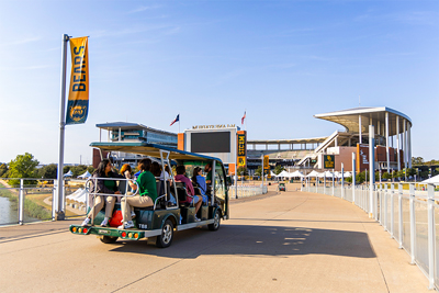Campus Tour guests on a shuttle going to McLane Stadium